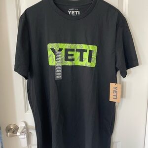 YETI Men's Black Tee with Green Logo